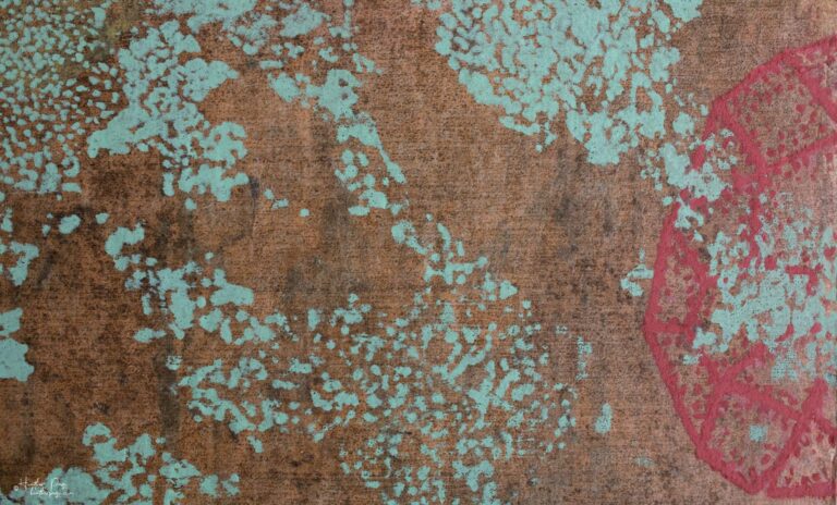 Detail of La Brume by Heather Page, a 12” by 20” by 2” monoprint on panel of silkscreened lichens & mold diagrams in blue, scarlet, & yellow over a copper field